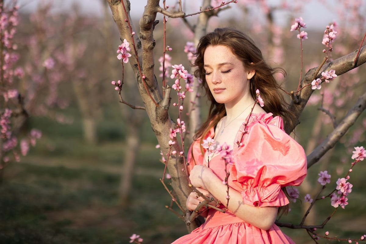 a young lady in peach orchards