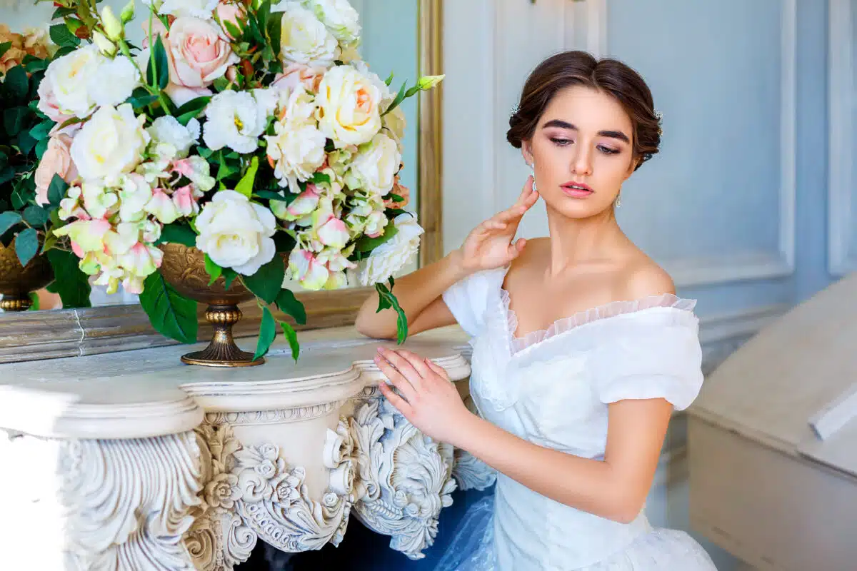 portrait of a beautiful girl in a ball gown in the interior. Concept of tenderness and pure beauty in sweet princess look. Beautiful girl in dress at romantic interior, fairytale in modern life