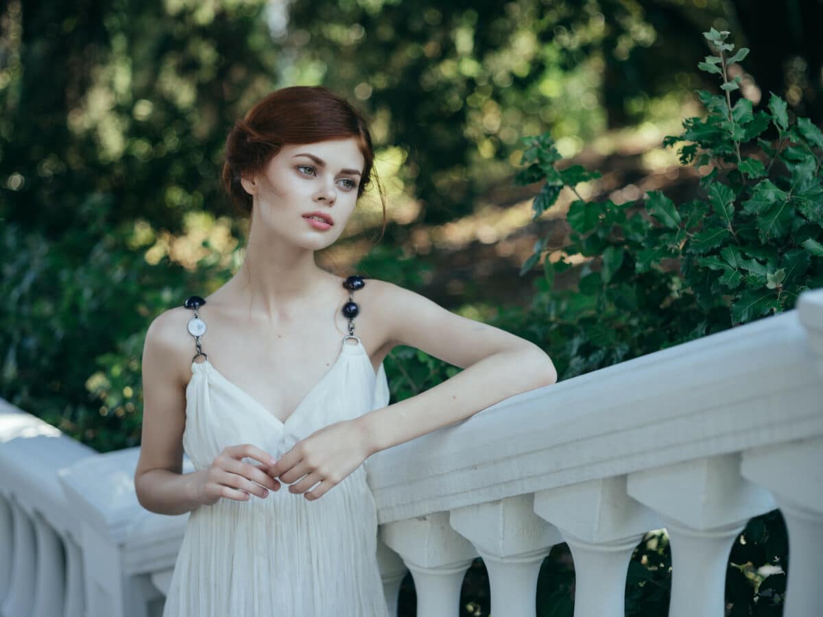 greek goddess woman in white dress in park nature fashion summer