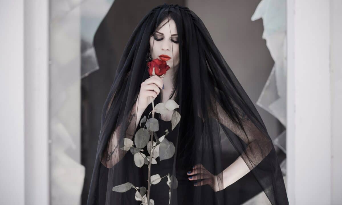 Gothic bride in black dress, veil with rose. Dark bride, ideas f