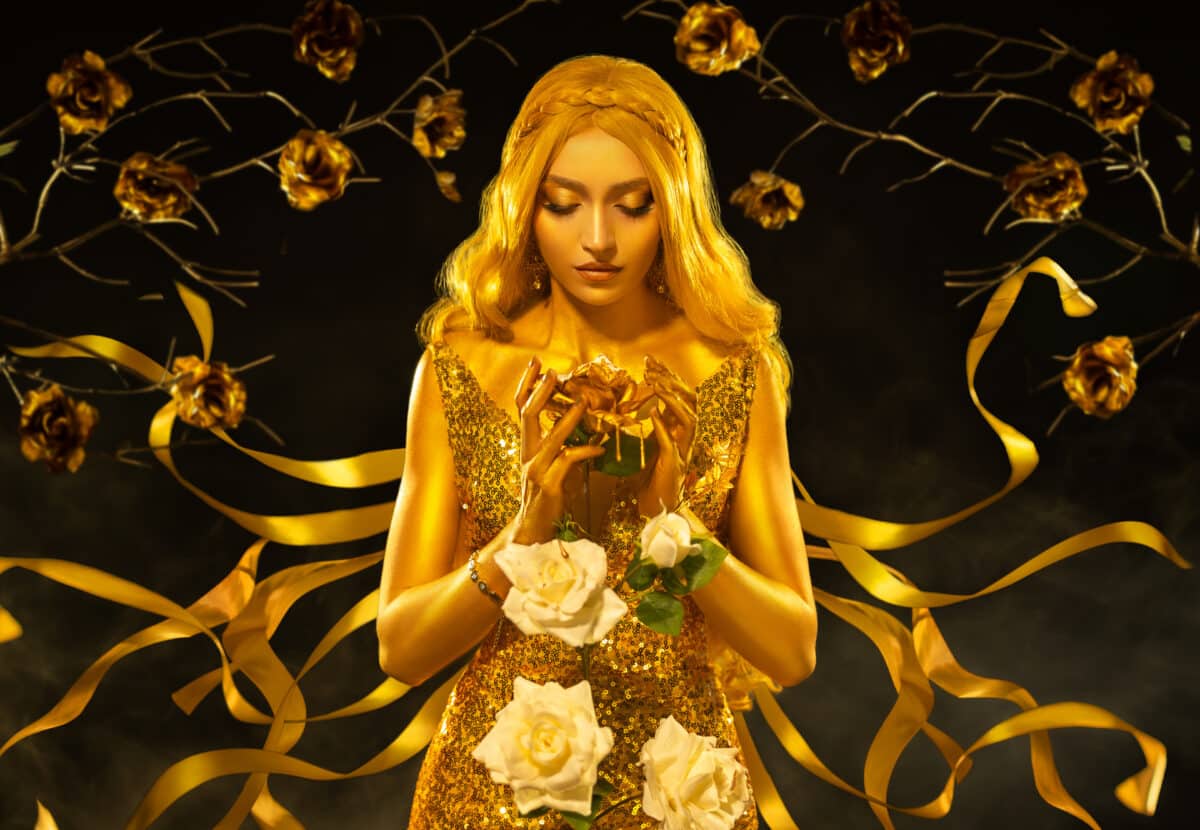 fantasy queen holding in hands white rose flowers. dress shines ribbon flies in wind. Night garden, gold roses tree
