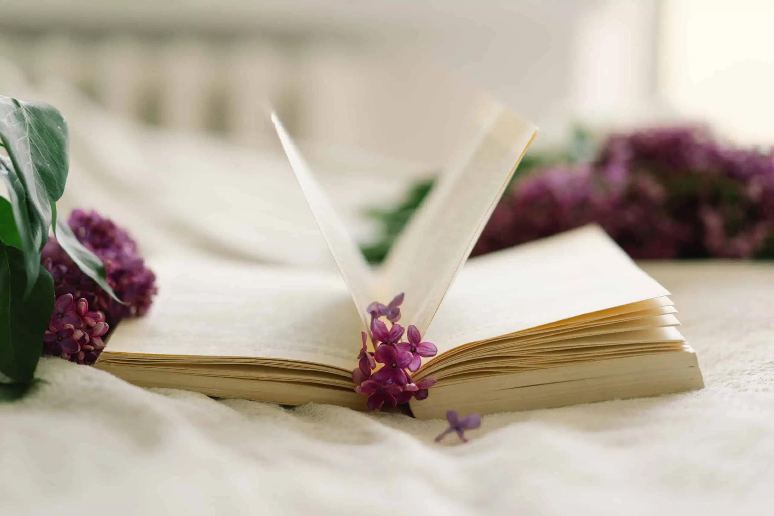 Open notebook with lilacs.