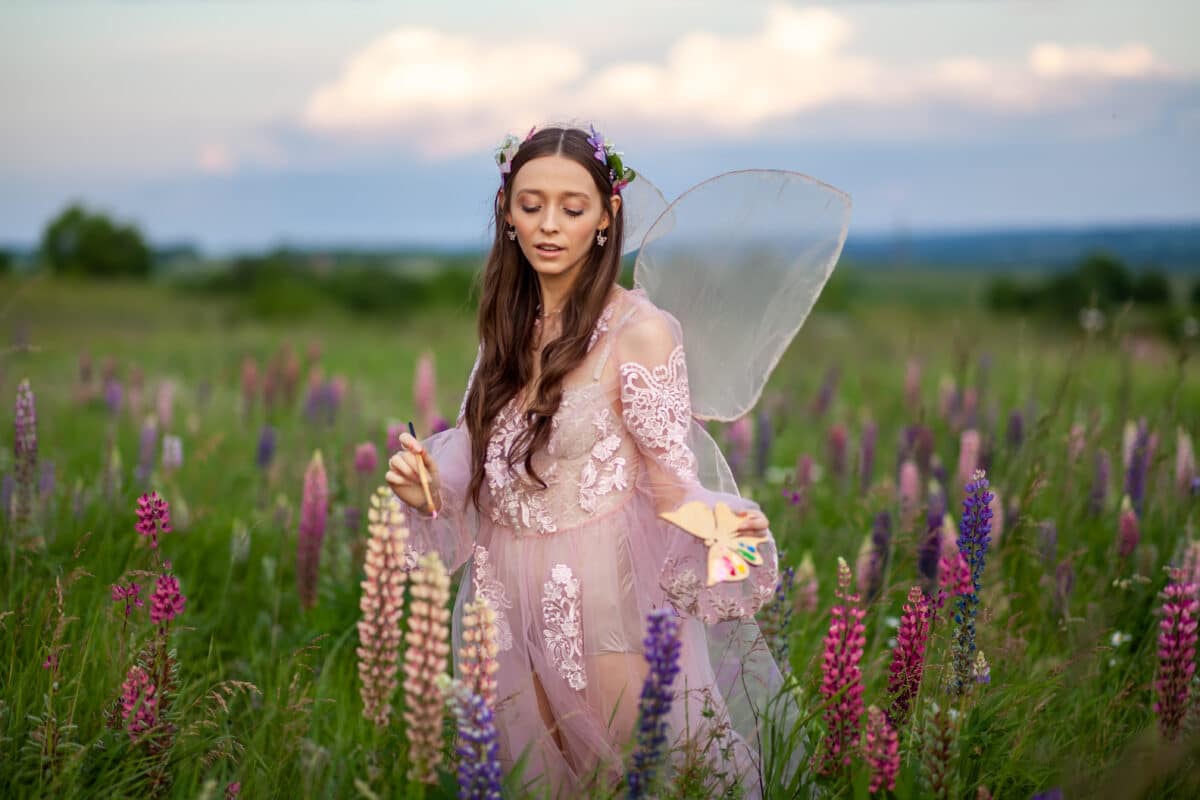 Beautiful lady in nature field of flowers.