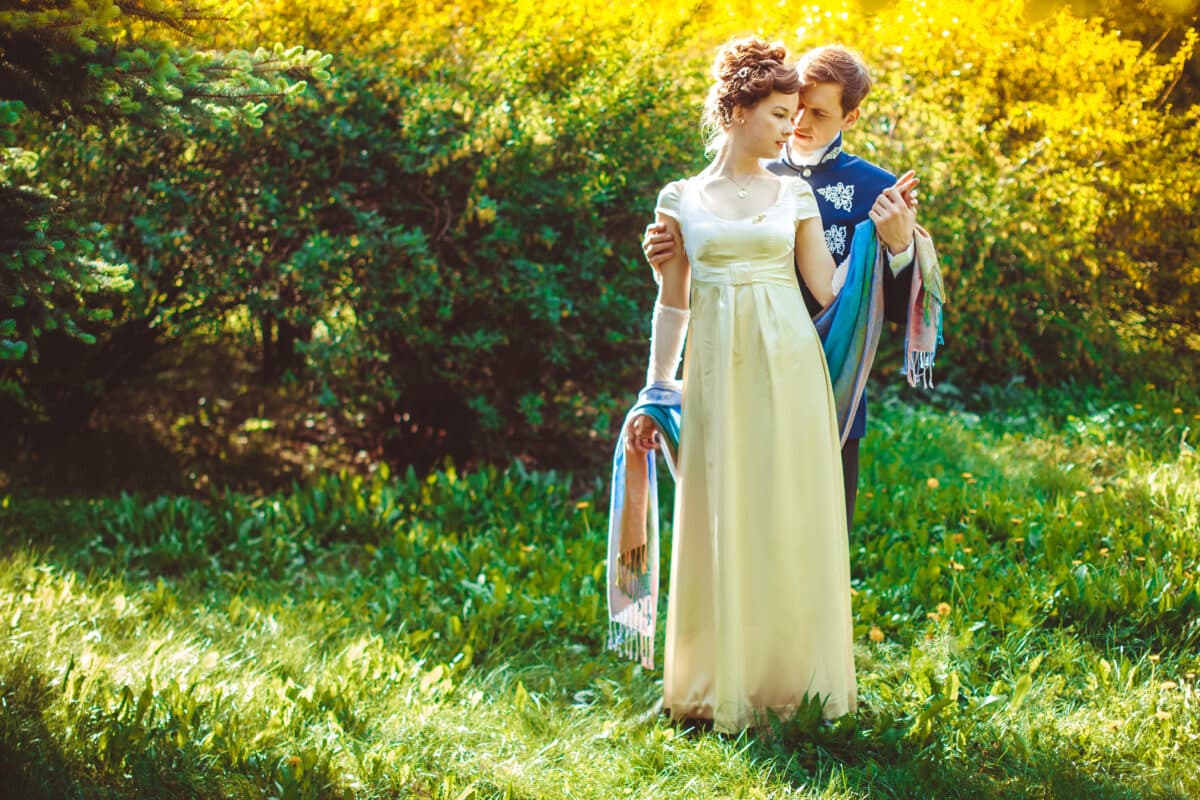 Beautiful and romantic aristocratic couple outdoor in the garden