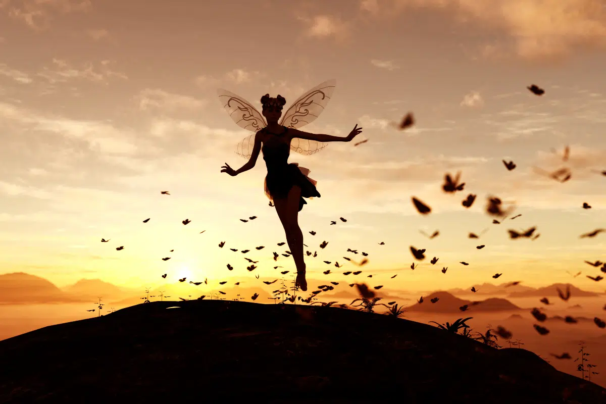 fairy on a tree trunk on the sky of a sunset or sunrise surrounded by flock butterflies