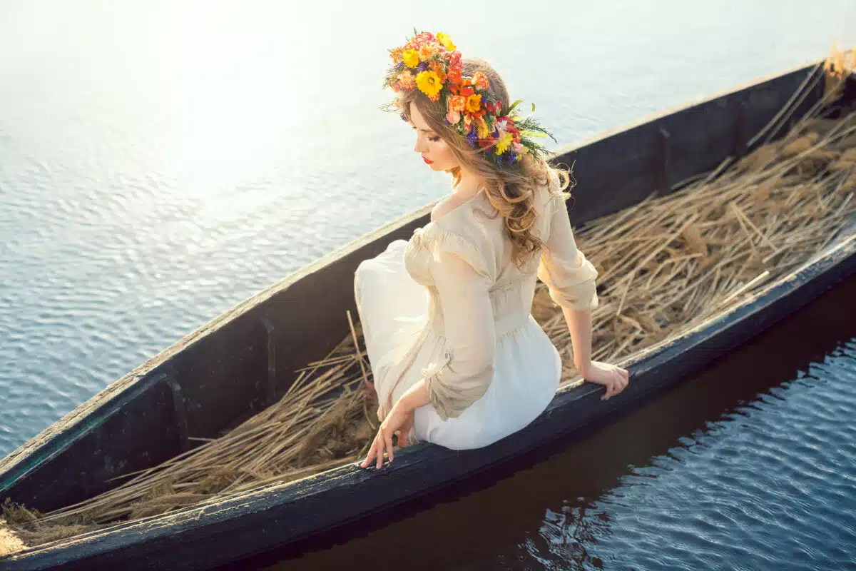 Beautiful girl sitting in the boat