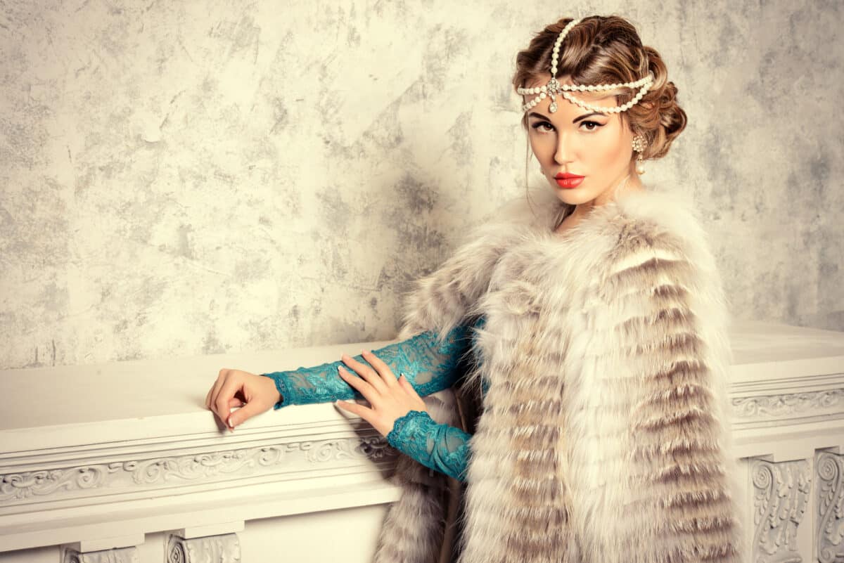 a stunning noble woman wearing an evening dress and beautiful furs