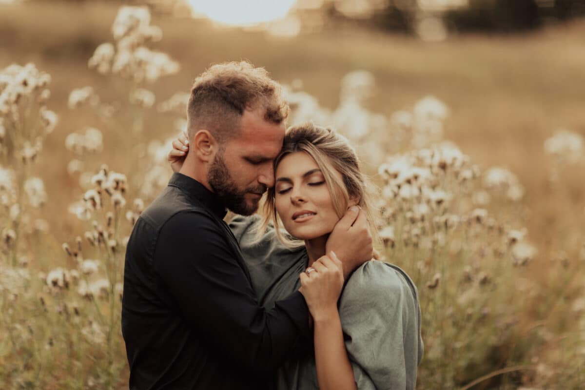 Young couple in love hugging in nature