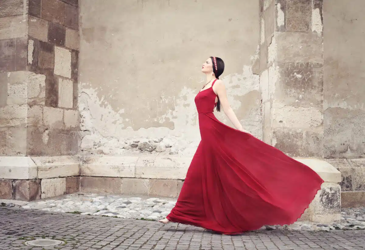 Woman in a red dress walking 