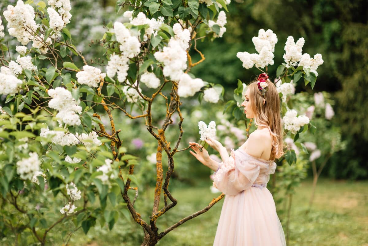 beautiful fairy-tale princess in the spring flowering garden