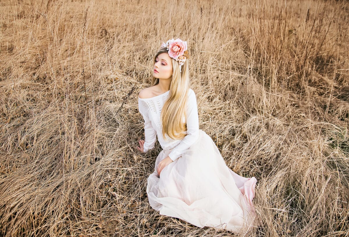 a beautiful nymph with sitting in the field
