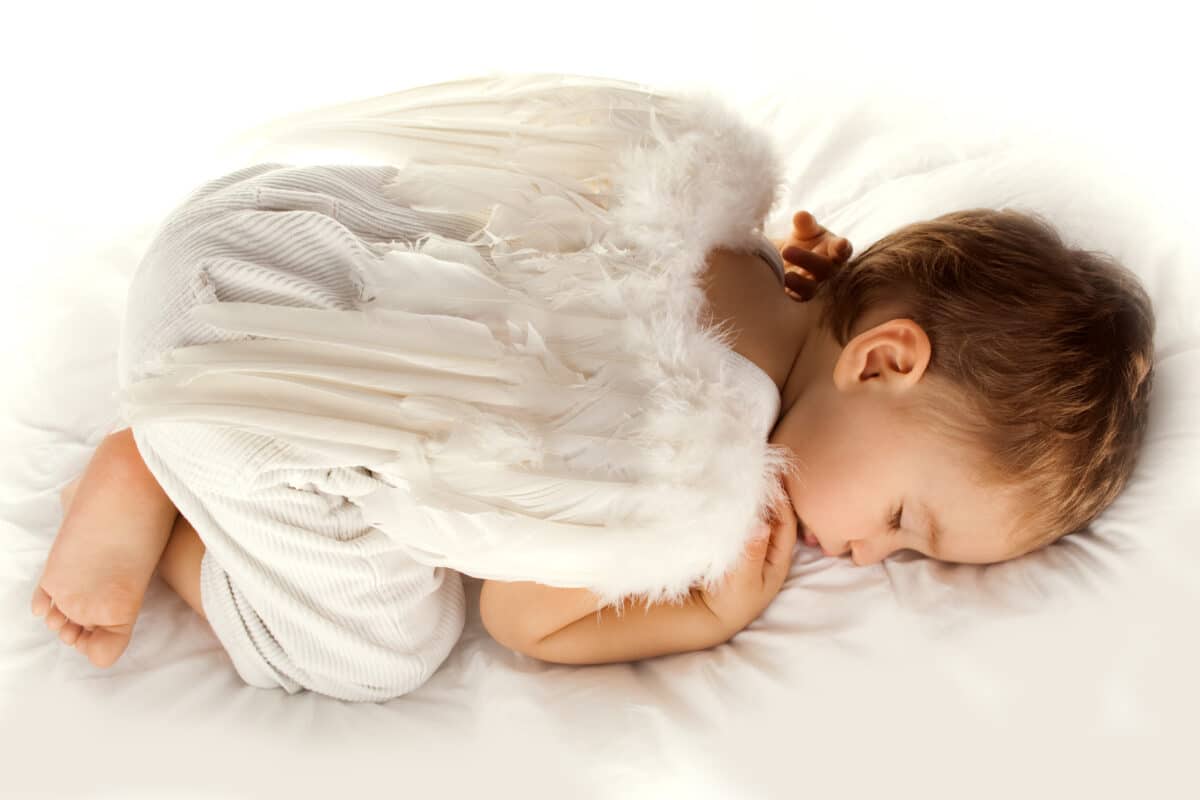 sleeping infant with wings