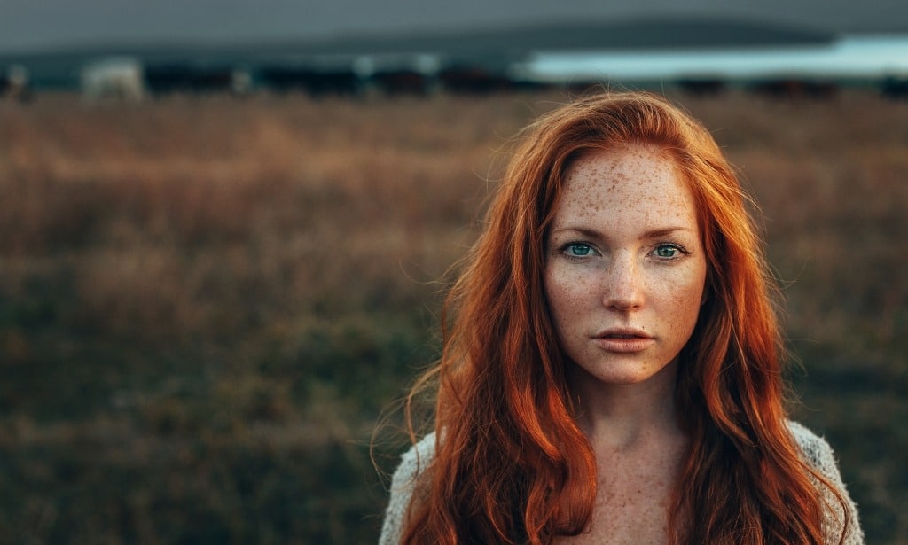Attractive red-head looking sad and grim.