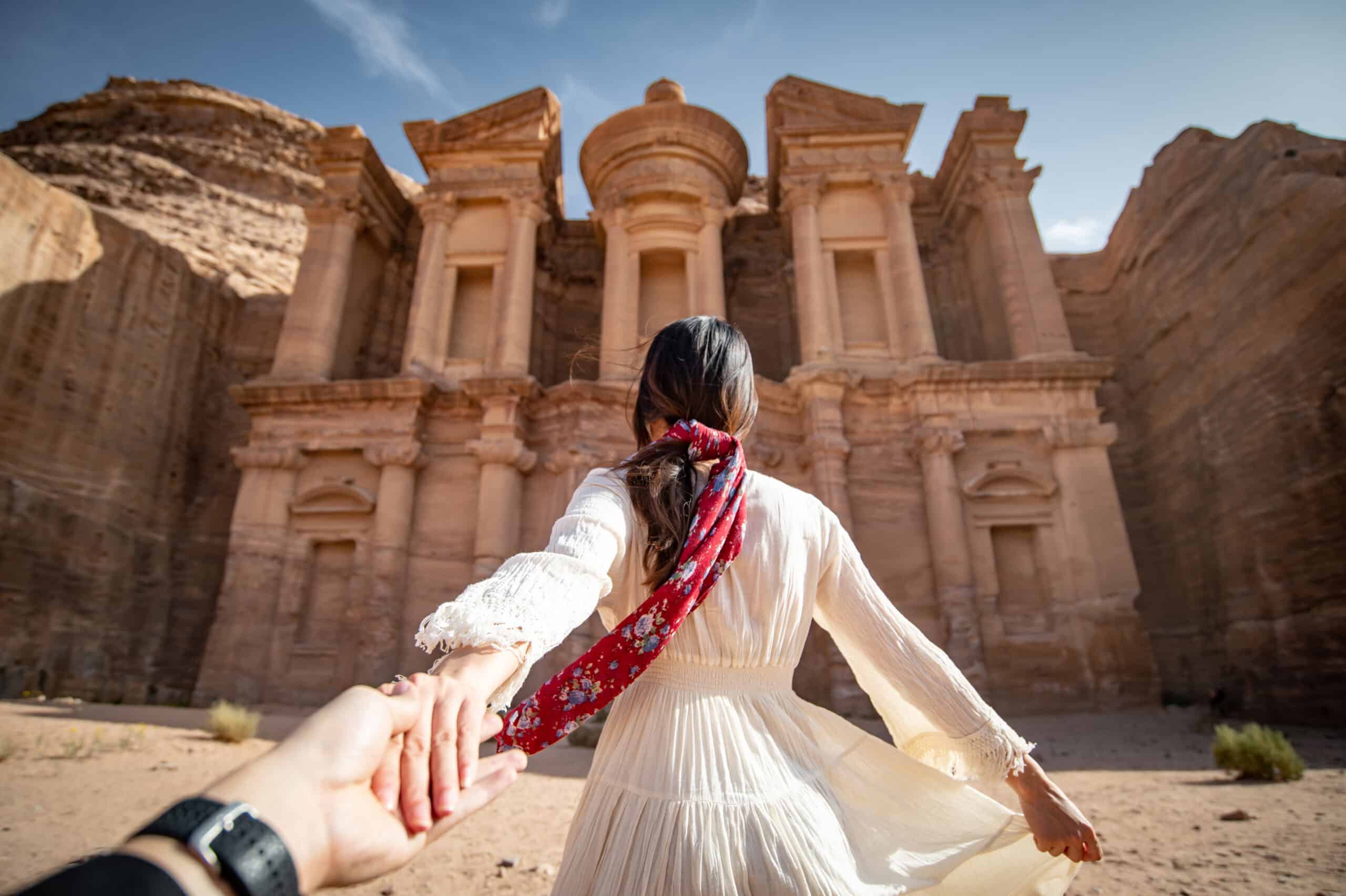 Asian woman tourist holding hand in Petra, Jordan