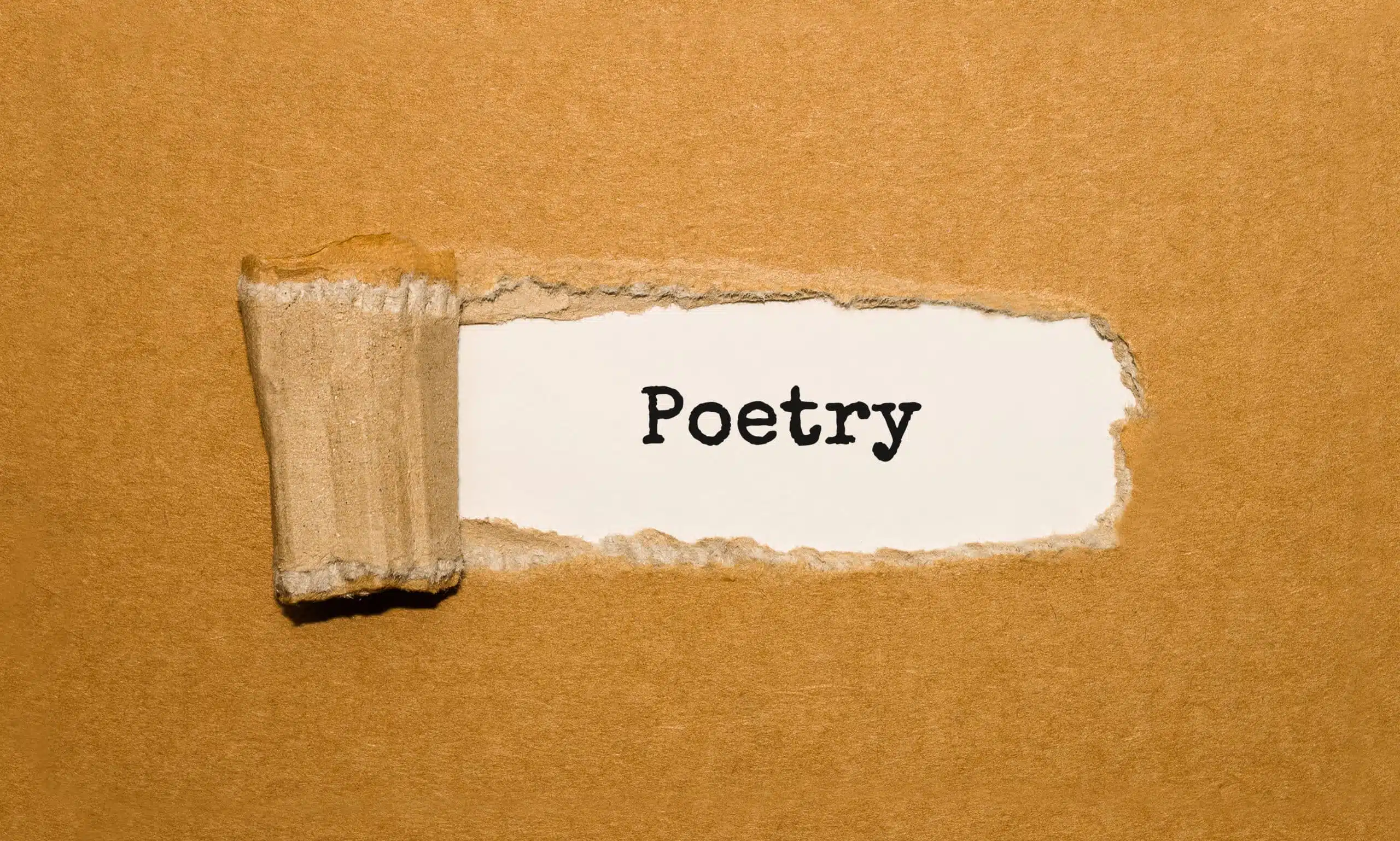 The text "Poetry" appearing behind the torn brown paper.