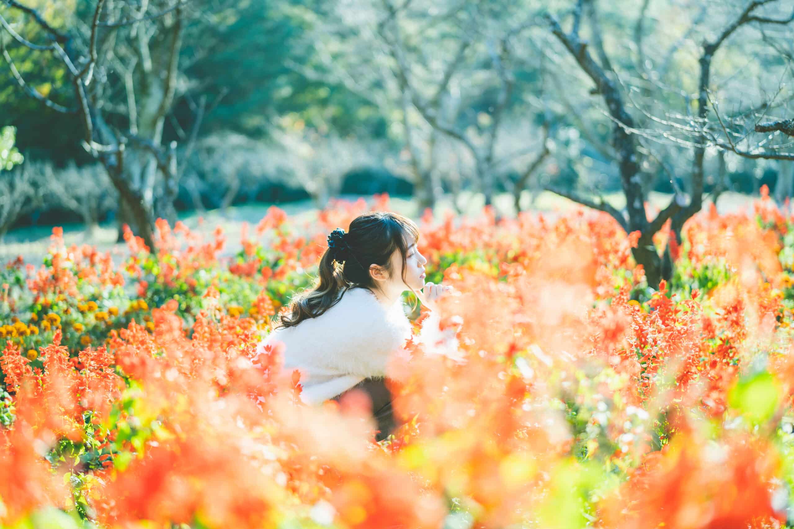 young girl enjoys the flowers in spring