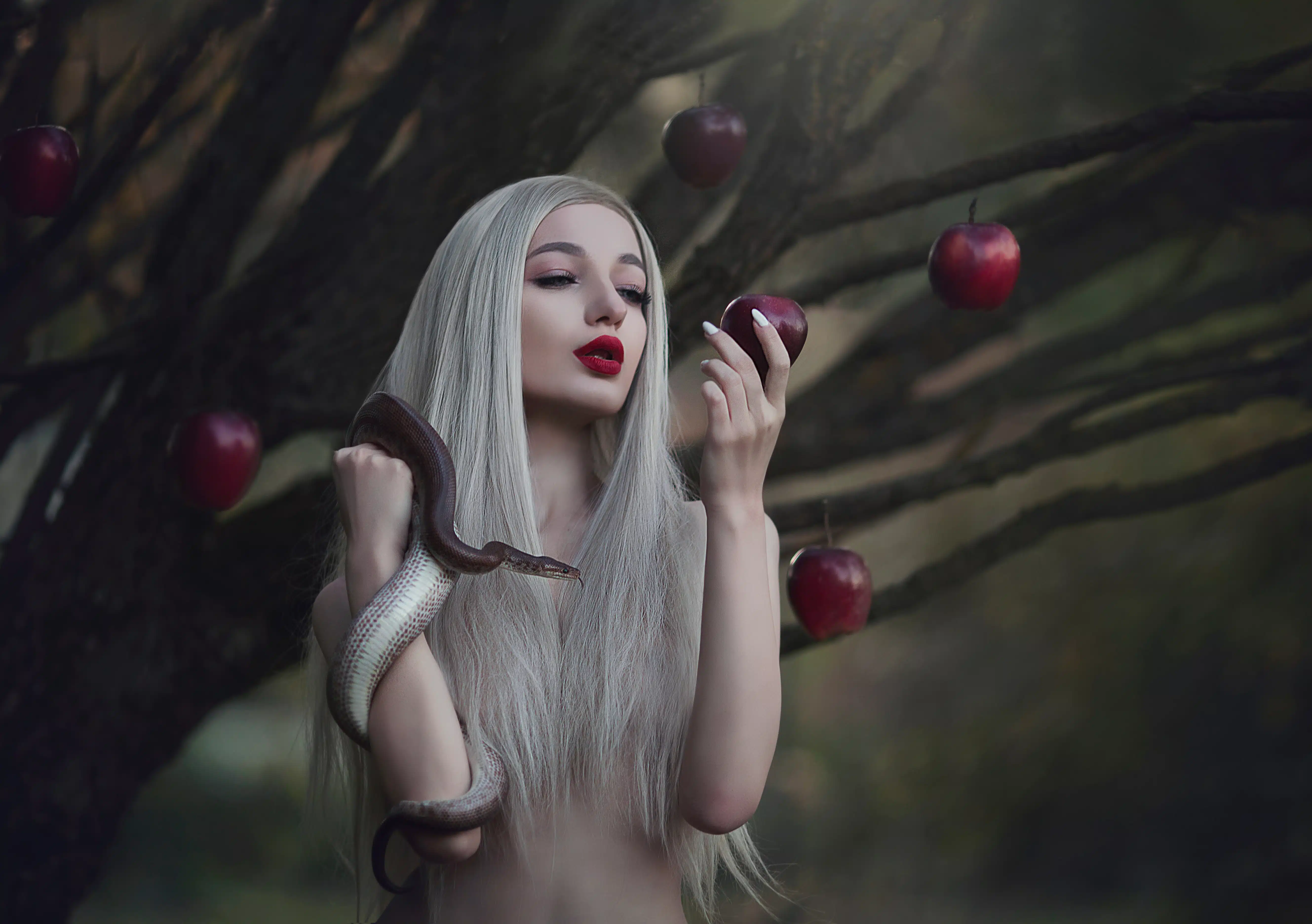 Eve with the serpent the tempter and the apple of sin. 