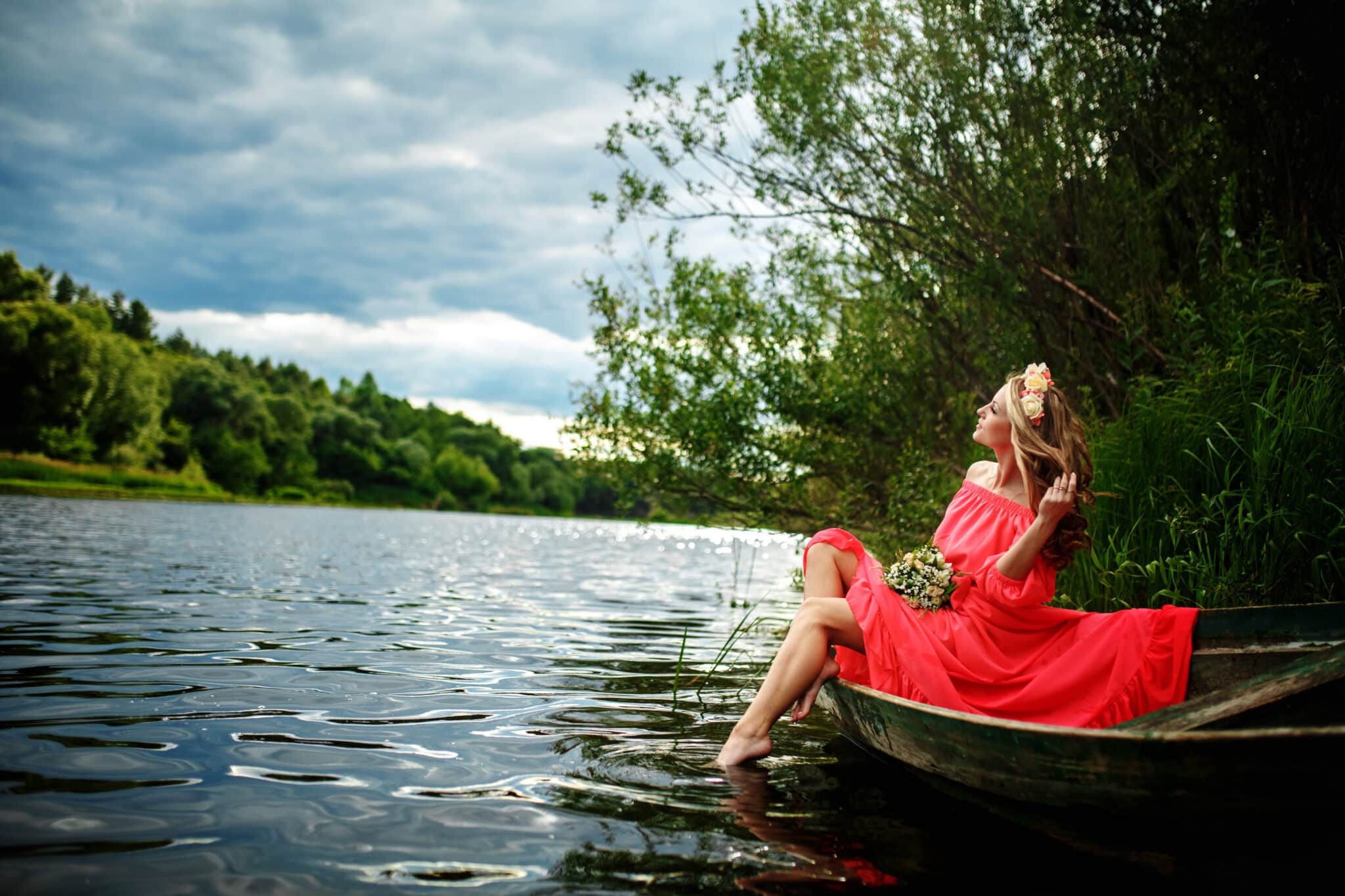 sensual woman in red dress on boat