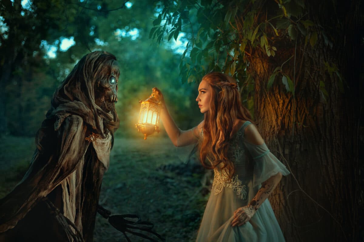 Fantasy woman elf walks in night forest, holding lantern in hands. Girl is hunted by dark fairy demon ghost of Death, black skeleton in cloak hood.