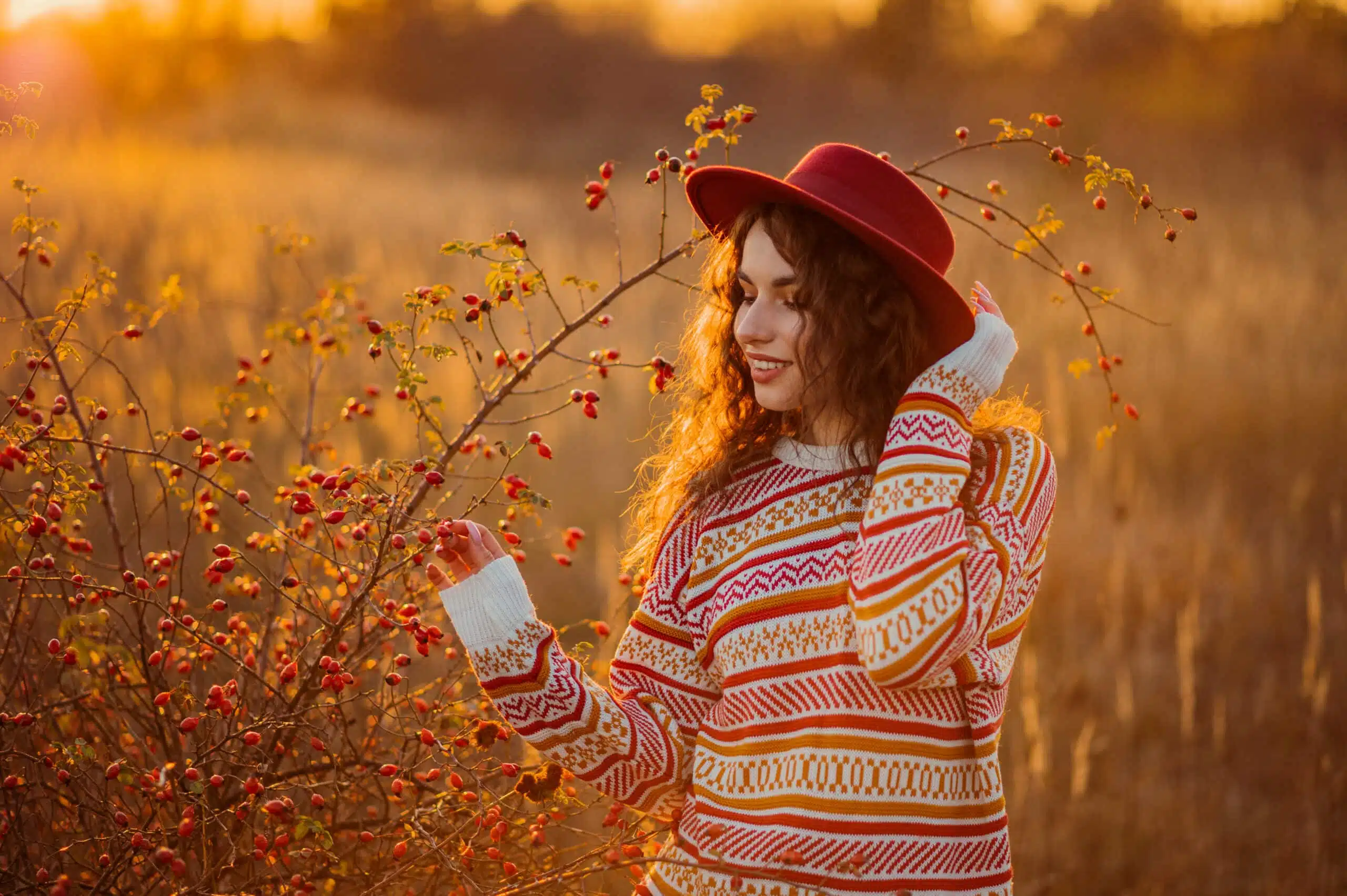 woman in read hat enjoying autumn outdoors