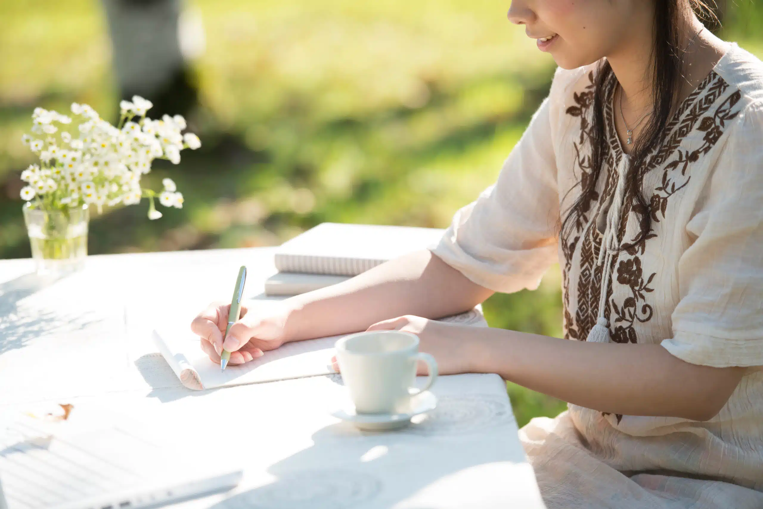 Japanese girl writing outdoor ion nature.