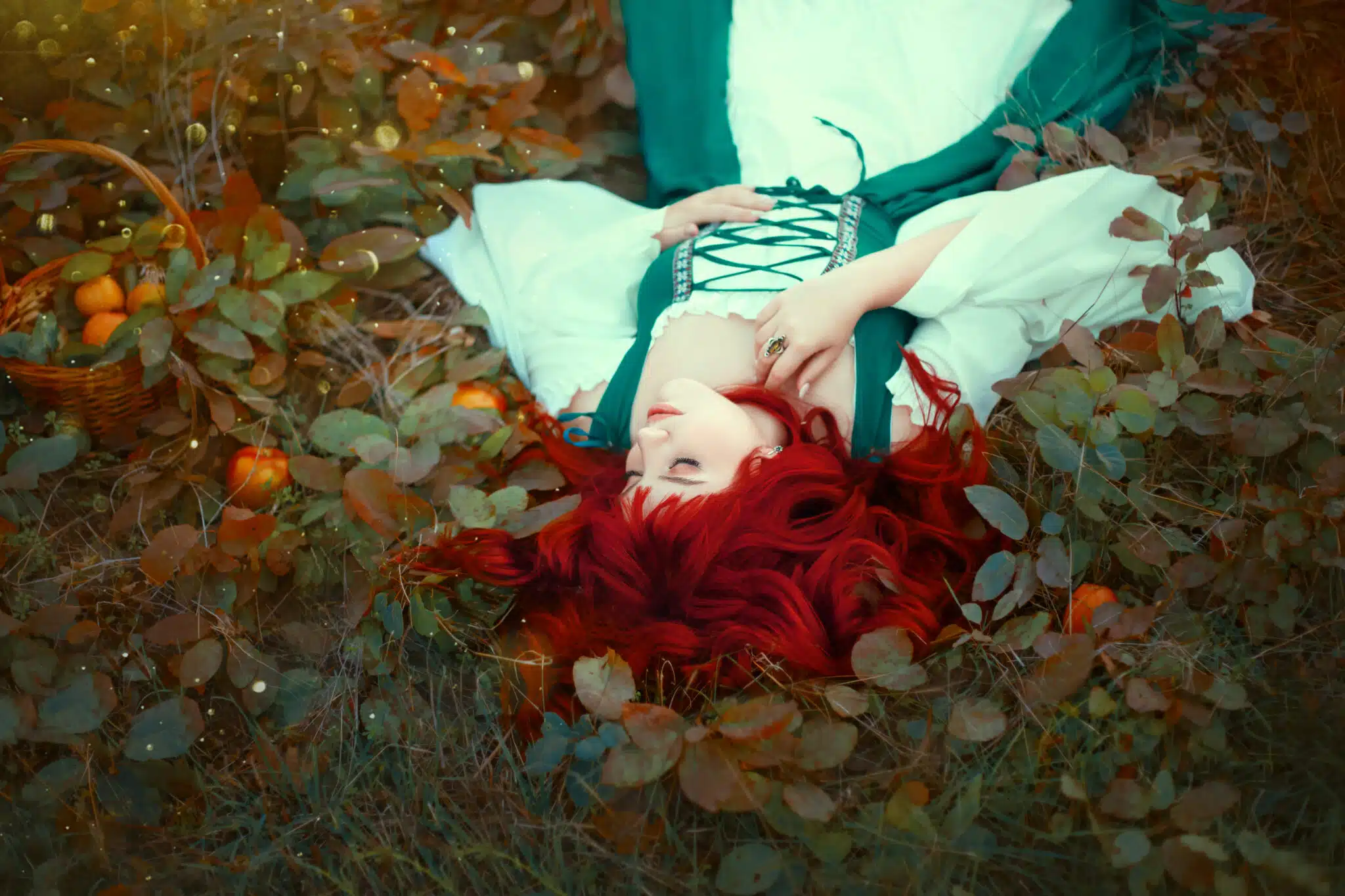 wonderful red-haired princess lying on the ground, torn with leaves, gently put her hand on her chest, dressed in a long green and white latte, silk fabric, apples fell out of the basket, brave girl