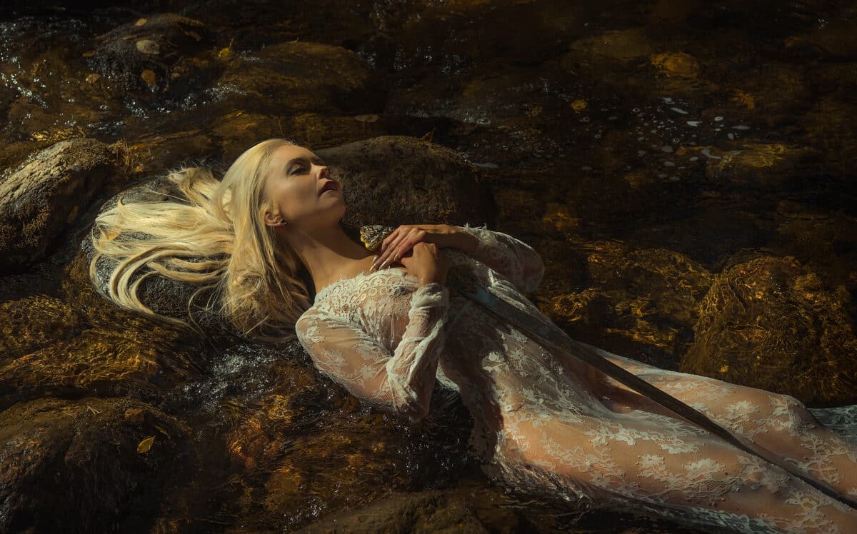 woman lying on the river, the legend of lady of the lake, beauti