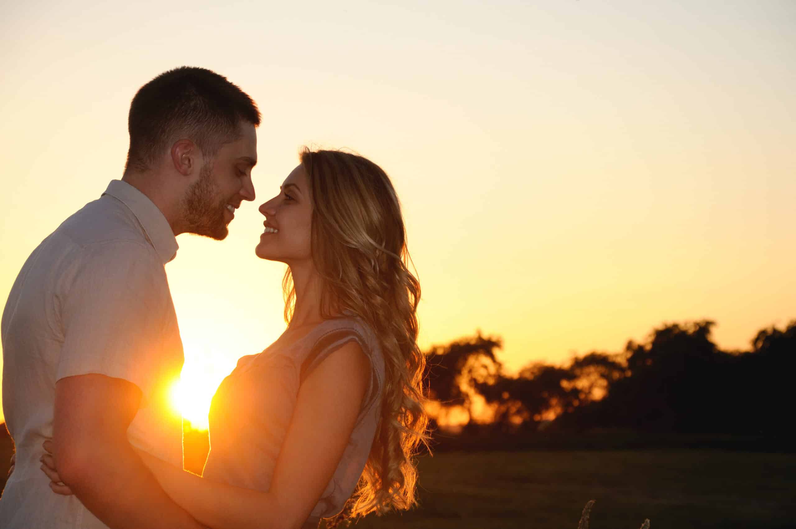 happy romantic young couple in love at the sunset