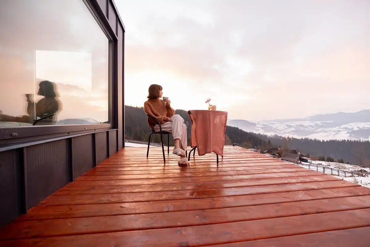 Woman resting alone at small house in the mountains.