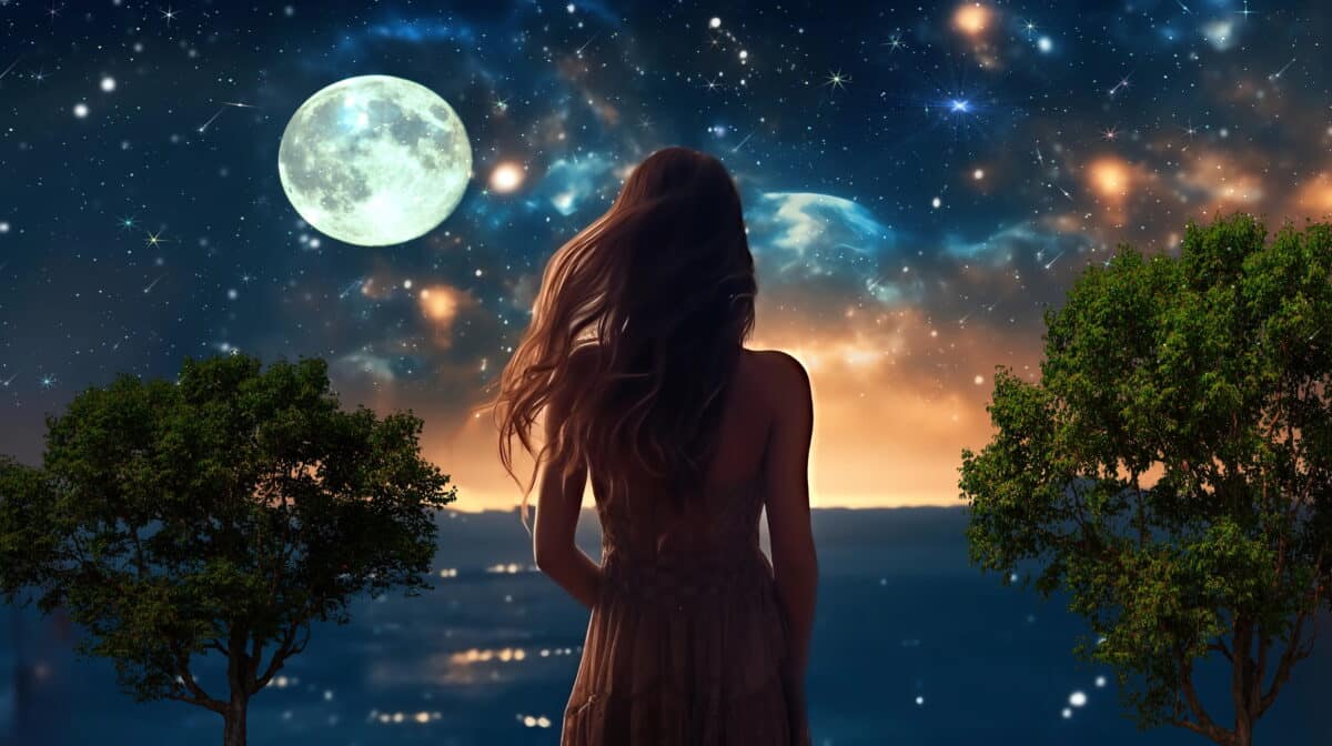 a beautiful young woman watches starry sky with the pale moon