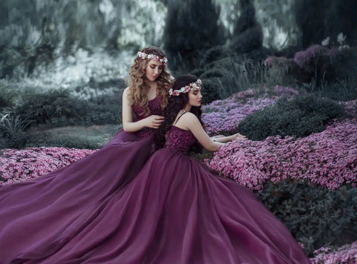nymphs are dressed in similar purple dresses, with lush skirts relaxing in the spring garden